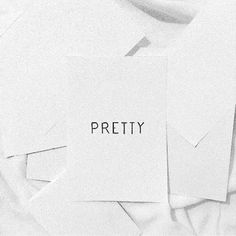 a pile of papers with the word pretty written on them