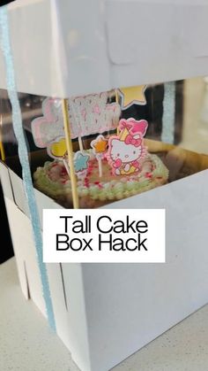 a hello kitty cake in a white box