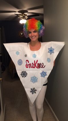 a woman wearing a bib with snowflakes on it and the words snakene written on it