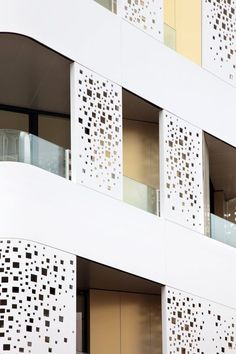 the building has several balconies with decorative designs on them