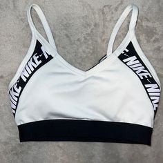 White Sports Bra With Black And White Logo And Mesh Back. Never Worn. Comes With Original Padding. Sporty White Activewear With Light Support, White Racerback Sports Bra, Athleisure Style, White Racerback Sports Bra Athleisure, White Racerback Sporty Activewear, White Sporty Racerback Activewear, White Athleisure Sports Bra, White Athletic Fit Sports Bra With Go-dry, White Go-dry Sports Bra, White Racerback Activewear For Sports