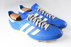 a pair of blue and white adidas shoes