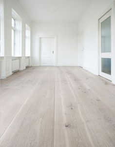 an empty room with white walls and wood floors is featured on the instagram page