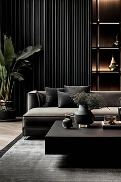 a modern living room with black walls and wooden flooring, large plant in the center