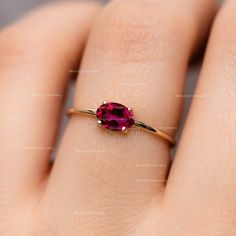 Natural Ruby Gemstone Anniversary Birthstone Gift Ring 14k Solid Yellow Gold Minimalist Vintage Jewelry Gift Ring July Birthstone Gift Ring ≫ Features * SKU : A012 * Gemstone : 100% Natural Ruby Gemstone  * Gemstone Shape : Oval  * Band Size : 1.3 mm * Gemstone Size : 6x4 mm * Birthstone : July  * 14K Solid Yellow Gold, ( Available in 14K & 18K Yellow, Rose, and White Gold ) * Option available in 18K Gold * All size available * Ready to Ship in 1-2 Weeks ≫ FAQ below for more detail. ✦ Sizing We can adjust most items to fit your sizing preferences. Most items can be made to any size and length. Please leave a note at checkout or contact us via Etsy conversation. Even after purchasing the item, you can still ask us to adjust the size or length. We will try our best to fix it if it is possibl 14k Gold Gemstone Birthstone Ring, Ruby Stackable Birthstone Rings, Ruby Birthstone Stackable Rings, 14k Gold Stackable Ruby Promise Ring, Stackable 14k Gold Ruby Ring For Promise, Promise Stackable 14k Gold Ruby Ring, Dainty Oval Birthstone Ring, 14k Gold Solitaire Crystal Ring, Minimalist Oval Birthstone Promise Ring