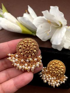 Shine like a glowing star in these high quality Kundan party wear studs lined with fine pearls .Pair them up with your silks and satins and add charm and charisma to your beautiful personality. Height = 30 mm || Width = 35 mm Latest Design Antique Earring Gorgeous studs with pearls. Highest quality and craftsmanship Ready to ship from NJ USA Please contact us for any questions Guttapusalu Earrings, South Indian Earrings, Studs Indian, Jewelry Pearl Earrings, Glowing Star, Beautiful Personality, Temple Jewelry, Jewelry Pearl, Indian Earrings