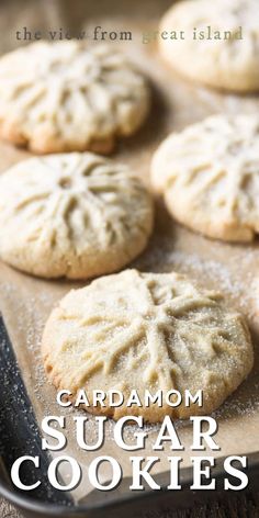 the view from great island cardamom sugar cookies on a baking sheet with powdered sugar