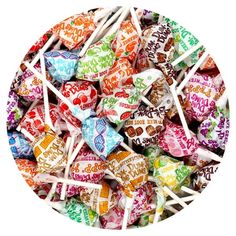 a pile of colorful candy lollipops sitting on top of each other