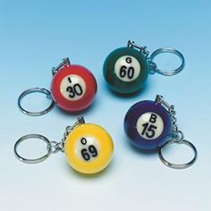 four pool ball keychains with the number 60 on them, all in different colors