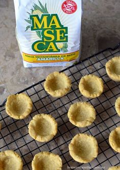 mini pies on a cooling rack next to a bag of mase caa