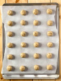 cookie dough balls on a baking sheet ready to be baked