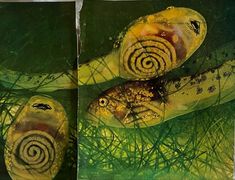 two fish are laying in the grass with spiral designs on their bodies, and one is yellow