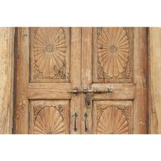 an old wooden door with ornate carvings on it