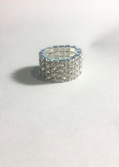 This lovely sparkling clear crystal rhinestone 4 Row Elastic Stretch Ring makes a statement! Perfect for weddings, Engagements, Parties or Anytime ! You don't have to worry about the size because it stretches so if you have a small finger or larger finger it will fit. Please feel free to ask any questions as I do not accept returns ! Diamond White Crystal Ring With Rhinestones, Silver Crystal Ring With Rhinestones, Dazzling Silver Crystal Ring With Rhinestones, Dazzling Crystal Rings With Rhinestones, Dazzling Crystal Ring With Rhinestones, Bling Crystal Ring For Promise, Bling Crystal Promise Ring, Crystal Promise Ring With Bling, Promise Crystal Ring With Bling