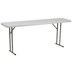 a white table sitting on top of a metal frame