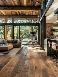 a living room filled with furniture and lots of windows