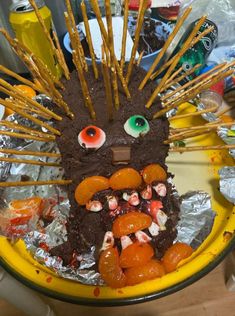 a cake with sticks sticking out of it's face