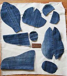 several pieces of denim sitting on top of a piece of paper