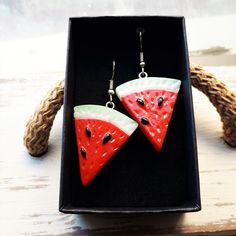 Watermelon earrings.  Cute kawaii fruit earrings. Dangle drop earrings with hypoallergenic stainless steel hooks. Choose between gold or silver steel hooks Vegan /vegetarian and fruit lovers earrings Watermelon measures 3cms long x 2.5cms wide  Total drop length: 5cms Weight: 3.4g  These earrings are carefully shipped in a cardboard box to guarantee you will receive them in perfect conditions. Please specify if you want them as a gift when you are ordering. No additional cost The packaging used Watermelon Colored Summer Jewelry Gift, Summer Watermelon Colored Jewelry For Gift, Handmade Watermelon Colored Jewelry For Gift, Handmade Watermelon-colored Jewelry Gift, Green Summer Jewelry With Fruit Design, Handmade Watermelon Colored Dangle Jewelry, Handmade Watermelon Color Dangle Jewelry, Fruit Design Jewelry As Summer Gift, Summer Fruit Design Jewelry As Gift