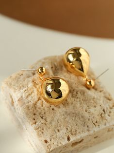 Introducing our elegant "Chic Metal Water Droplet Ball Drop Earrings," a stunning blend of sophistication and modern style. Made with high-quality metal and plated in luxurious gold, these earrings exude undeniable charm and durability. Designed for the trend-setting individual, these versatile earrings add a touch of whimsy to any occasion, from casual to formal. With lightweight construction and secure closure, they are comfortable to wear all day. Metal: 18K Recycled Gold Plated On Brass/Recy Ball Drop Earrings, Ball Drop, Chic Earrings, Water Droplets, Elegant Chic, Recycled Gold, Drops Design, Brass Earrings, Recycled Sterling Silver