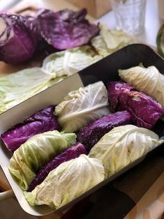 cabbage and lettuce in a pan on a table