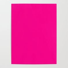 a bright pink piece of paper on a white surface