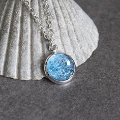 Don't you just love a touch of sparkle?! This necklace features a light-blue resin druzy cabochon set on a silver setting! What I love most about this style is the versatility - druzy items can add glam to a simple jeans and t-shirt look, or they can be paired with a more formal outfit for some sparkling elegance. Dress them up or down!  2 METAL OPTIONS (choose one): - Silver brass (brighter silver option), which is nickel free and lead free - Stainless Steel (slightly darker silver, better for Light Blue Necklace, Pink Drop Earrings, Blue Pendant Necklace, Druzy Necklace, Shop Light, Buy Necklace, Blue Pendant, Personalized Pendant, Necklace Blue