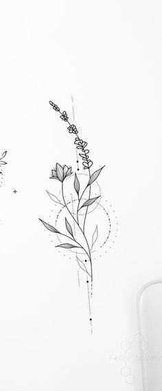 a black and white photo of some flowers on a sheet of paper next to a cell phone