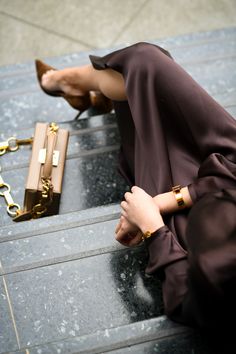 a woman laying on the ground with her legs crossed