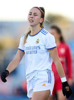 a female soccer player in action on the field