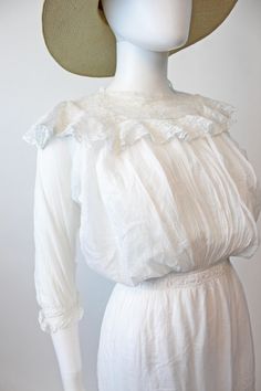 "Sweet and totally wearable Edwardian dress! Done in a delicate cotton with tons of filet lace detailing throughout. This is incredible since it has so many attached layers. The bodice has a cotton corset tank style top that buttons in back and then the sheer ruffled lace layers over that. The tiniest buttons are on the back of this layer. Both pieces are fully pintucked. Lace skirt has three layers with lace on each layer. Waist has slits for a ribbon to thread through if you desire! And the ow Cottagecore Daywear Dress With Lace Trim, Cottagecore Lace Trim Dress For Daywear, Cottagecore Dresses With Lace Trim For Daywear, Cottagecore Day Dress With Lace Trim, Victorian Dress For Summer Garden Party, Cottagecore Lace Dress For Daywear, Cottagecore Lace Day Dress, Delicate White Dress For Daywear, Delicate Fitted Daywear Dresses