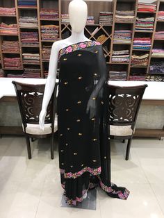 A Marvellous Embroidered Kashmiri Saree which you can wear at any party or a wedding. - - - - - - - - - - - - - - - - - - - -  Product Details - Condition: Brand New (made to order) - Style: Sari Dress - Embroidery: Papier Mache Hand Embroidery - Base Colour: Black - Embroidery Colour: Multi-Colour - Care Instructions: Dry Clean Only F A B R I C Saree: Viscose Georgette Blouse: Indian Crepe F I N I S H - Unstitched You can get it stitched locally. - Stitched Want your blouse ready to wear, let us know the style you want and we will stitch it for you. PLEASE NOTE: We would require you to share certain precise body measurements to stitch the blouse.  If you require guidance on how to take your measurements, please drop us a message. - Blouses are not made to US/UK/EU sizing charts, they are Semi-stitched Embroidered Georgette Dress, Fitted Georgette Sharara With Embroidered Border, Fitted Sharara With Embroidered Border For Party, Fitted Party Blouse With Embroidered Border, Georgette Dresses With Embroidered Border For Navratri, Navratri Georgette Dress With Embroidered Border, Fitted Traditional Wear With Embroidered Border For Party, Fitted Georgette Lehenga With Embroidered Border, Black Dress With Resham Embroidery For Celebration