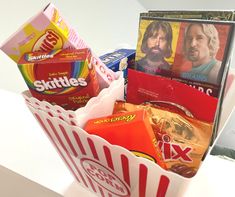 a box filled with candy and snacks sitting on top of a table