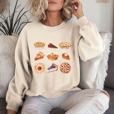 This cute Fall Vibes Thanksgiving Sweatshirt is the perfect cozy addition to your wardrobe for the autumn season. Whether you're celebrating Thanksgiving with family or friendsgiving with your loved ones, this sweatshirt exudes warm vibes and comfort. It is ideal for anyone looking for a stylish and festive outfit for the fall holidays. HOW TO ORDER - Select your desired size, color, and design from the dropdown menus. - Add each t-shirt to your cart separately. - Once you've selected all your i Cottagecore Thanksgiving, Thanksgiving With Family, Thanksgiving Sweatshirt, Girls Thanksgiving, Thanksgiving Family, Family Shirt, Thanksgiving Gift, Thanksgiving Outfit, Fall Holidays