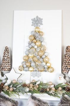 a christmas tree made out of gold and silver ornaments on top of a mantel