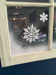 a snowflake is seen in the window of a restaurant