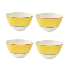 four yellow and white bowls sitting next to each other