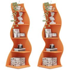 two orange shelving units with plants and books on each shelf in front of white background