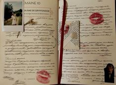 an open book with writing on it and pictures attached to the pages that are covered in red ink