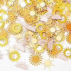 gold and silver glitter starburst cutouts on white background with space for text