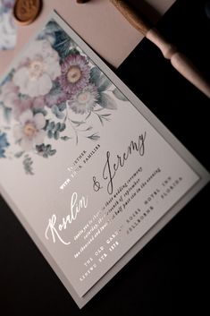 a close up of a wedding card on a table