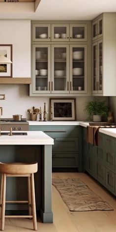 an image of a kitchen setting with stools in the foreground and cabinets in the background