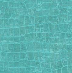 the texture of an alligator skin pattern in turquoise green