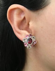 A Statement Earring handcrafted in Rose Gold Plated over Sterling Silver features a center Garnet embellished with Multi-color Spinel and Tourmaline and Halo Diamonds. A stunning, jaw-dropping stud earrings that makes a commanding statement earrings.(e-c-63) Earring measure 9mm x 20mm *LIKE* us on Facebook http://www.facebook.com/Belesas to get 10%off coupon code, *FOLLOW* us on Twitter https://twitter.com/#!/Belesas to get more exclusive coupon codes *All item are ready to ship! Free shipping o Multicolor Diamond Gemstone Earrings, Unique Multi-stone Earrings For Formal Occasions, Fusion Multi-stone Pink Jewelry, Luxury Pink Multi-stone Earrings, Elegant Red Multi-stone Earrings, Unique Formal Multi-stone Earrings, Multicolor Gemstone Accented Earrings For Formal Occasions, Pink Oval Ruby Earrings, Elegant Multicolor Oval Earrings