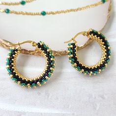 These Green and gold hoop earrings are uniquely crafted of Superior quality Japanese Miyuki Delica seed beads.  Each bead is carefully selected and threaded.   These Elegant beaded hoop earrings are a thoughtful present for mom, wife, girlfriend, best friend, girls, teen girls, or yourself on Christmas, Birthday, Anniversary, Mother's Day, Valentine's Day, or just send as a surprise gift for that special one in your life to remind her how much you care. Earrings Diameter:27 mm (1.06) hoop. Small Hoop Gold Beaded Jewelry, Hoop Beaded Earrings With Spacer Beads, Colorful Beads Small Hoop Jewelry, Handmade Beaded Hoop Earrings Gift, Handmade Beaded Hoop Earrings For Gifts, Green Beaded Hoop Earrings For Gift, Colorful Beads Small Hoop Earrings As A Gift, Colorful Beads Small Hoop Earrings For Gift, Gift Dangle Hoop Earrings With Spacer Beads