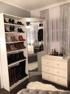 a white closet with shoes on the shelves