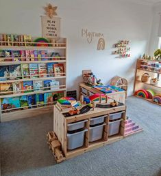 a child's playroom with toys and bookshelves