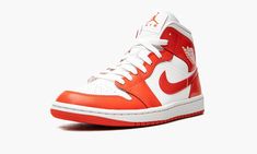 The Women’s Air Jordan 1 Mid “Habanero Red” is a women’s-only colorway of the popular mid-top retro basketball shoe that appears in a classic two-tone, white-and-red color scheme.  Though the shades of red used on both shoes differ, the “Habanero Red” channels the look of the white-and-red Air Jordan 1 High ‘85 “New Beginnings” colorway that appeared alongside a Nike Air Ship as part of a collection of the same nickname back in February 2020.  Like the coveted “New Beginnings” Jordan 1 ‘85, the Nike Air Ship, Air Ship, Wmns Air Jordan 1, Vapour Max Nike, Red Jordans, Retro Basketball Shoes, Retro Basketball, Red Color Schemes, Air Jordan 12 Retro