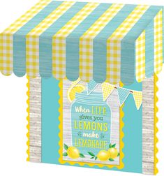 a blue and yellow striped awning with lemons on it