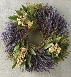 a wreath made out of lavender and greenery